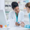 pharmacist speaking with a woman
