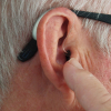 close-up of an ear, with a hearing aid